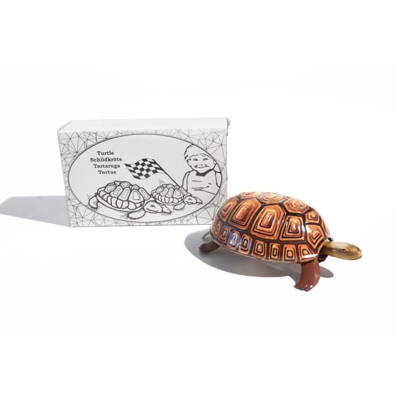 Tortuga metálica amarilla a cuerda