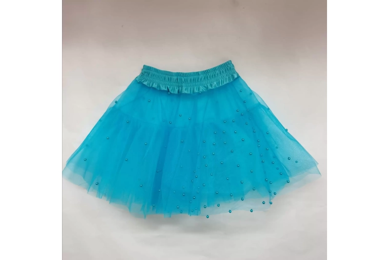 Faldilla perles turquesa