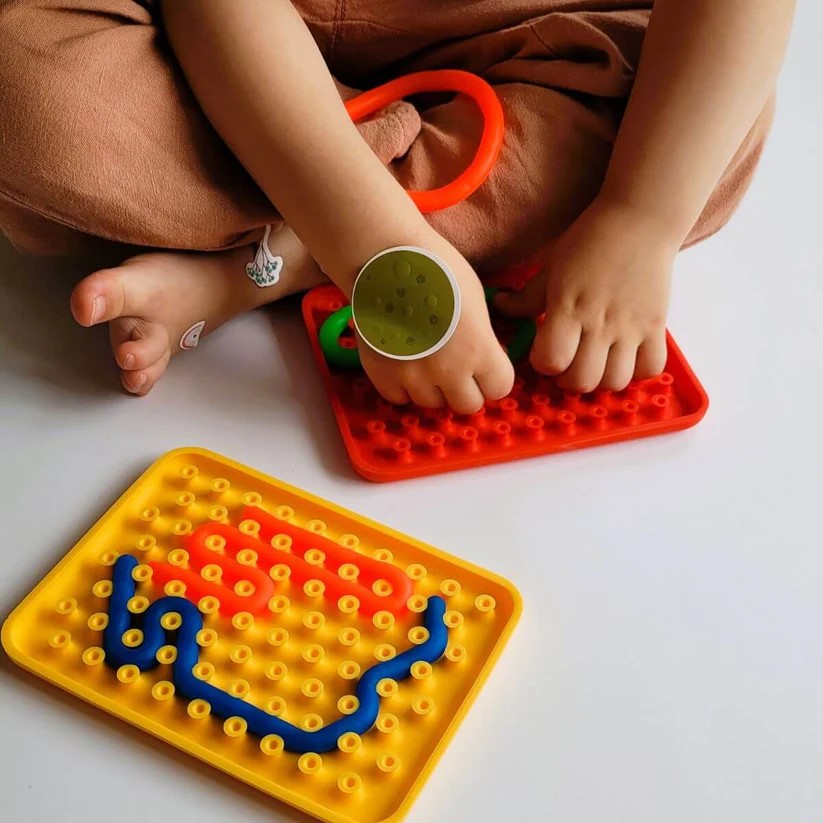 Panel sensorial Wiggly Toy Naranja